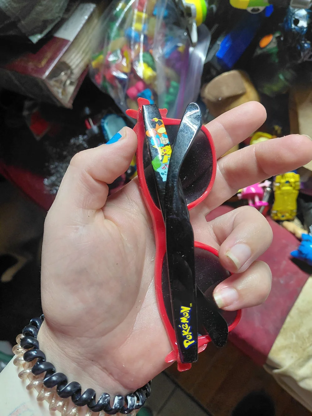 Nintendo Pokémon Pikachu sunglasses feature a red frame with a Poké Ball pattern